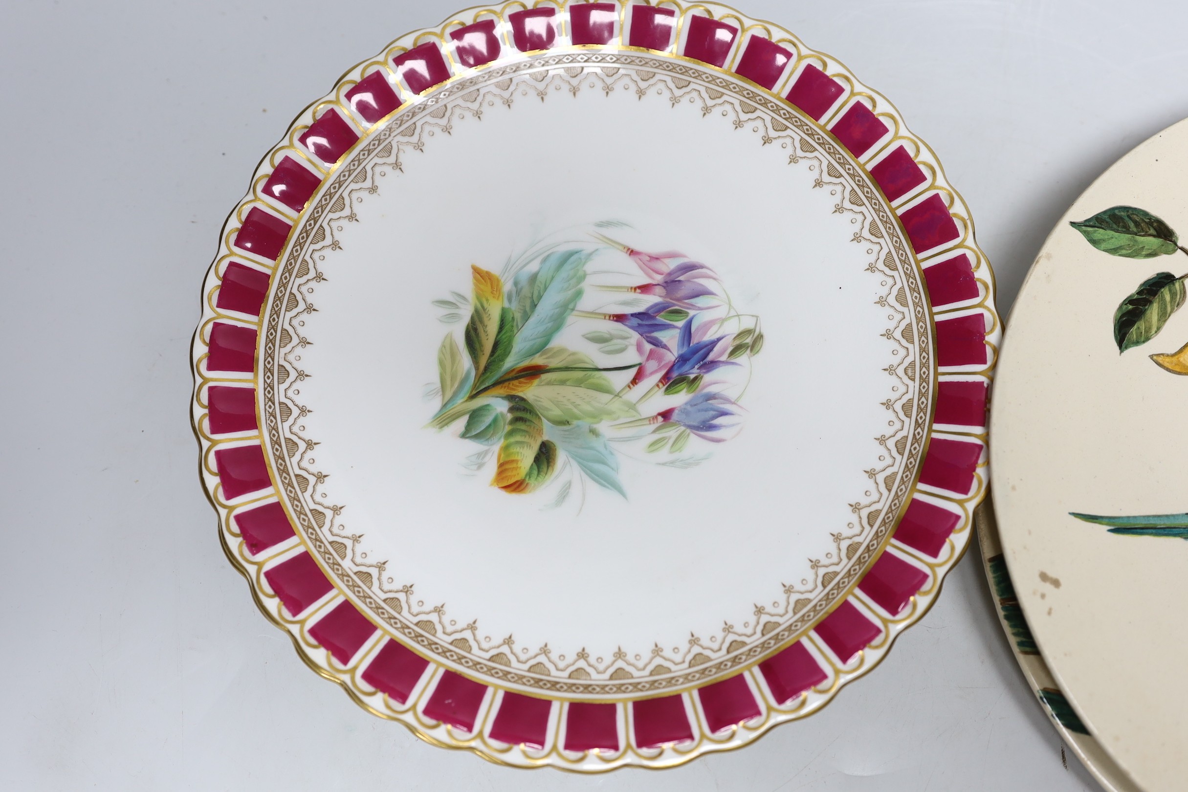 A pair of Doulton plates, a pair of floral plates, a Victorian nursery plate and a large flow blue cup and saucer